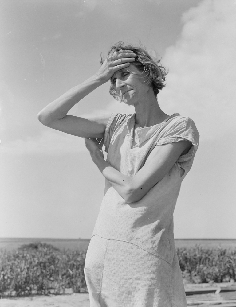 Wife of a migratory laborer with three children. Near Childress, Texas. Nettie Featherson, 1938