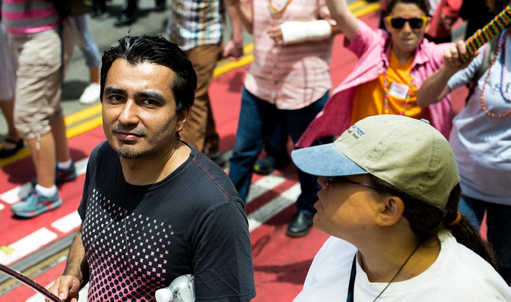 A man walking during the San Francisco Pride parade